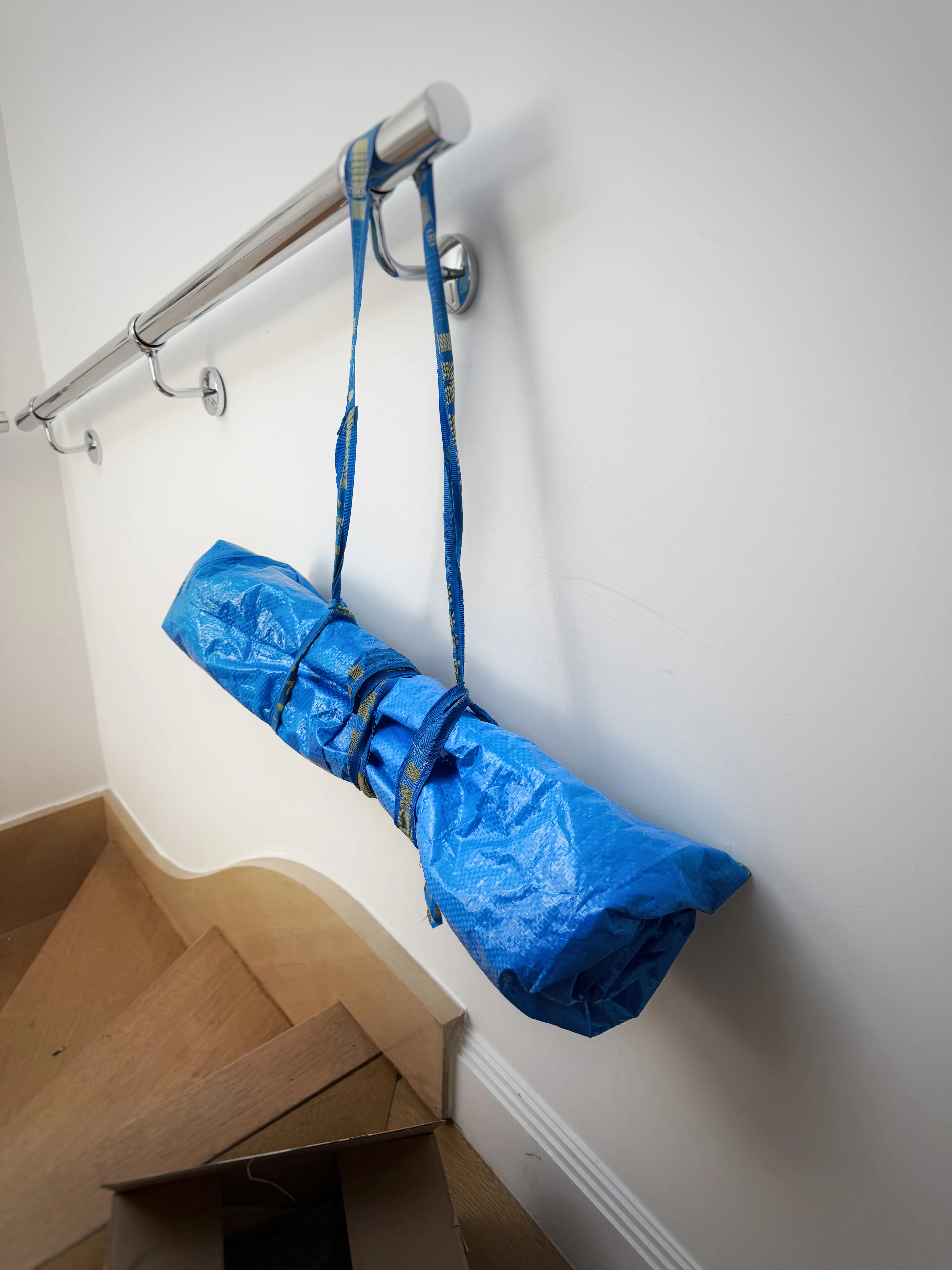 ikea picnic blaknet hanging off a handrail
