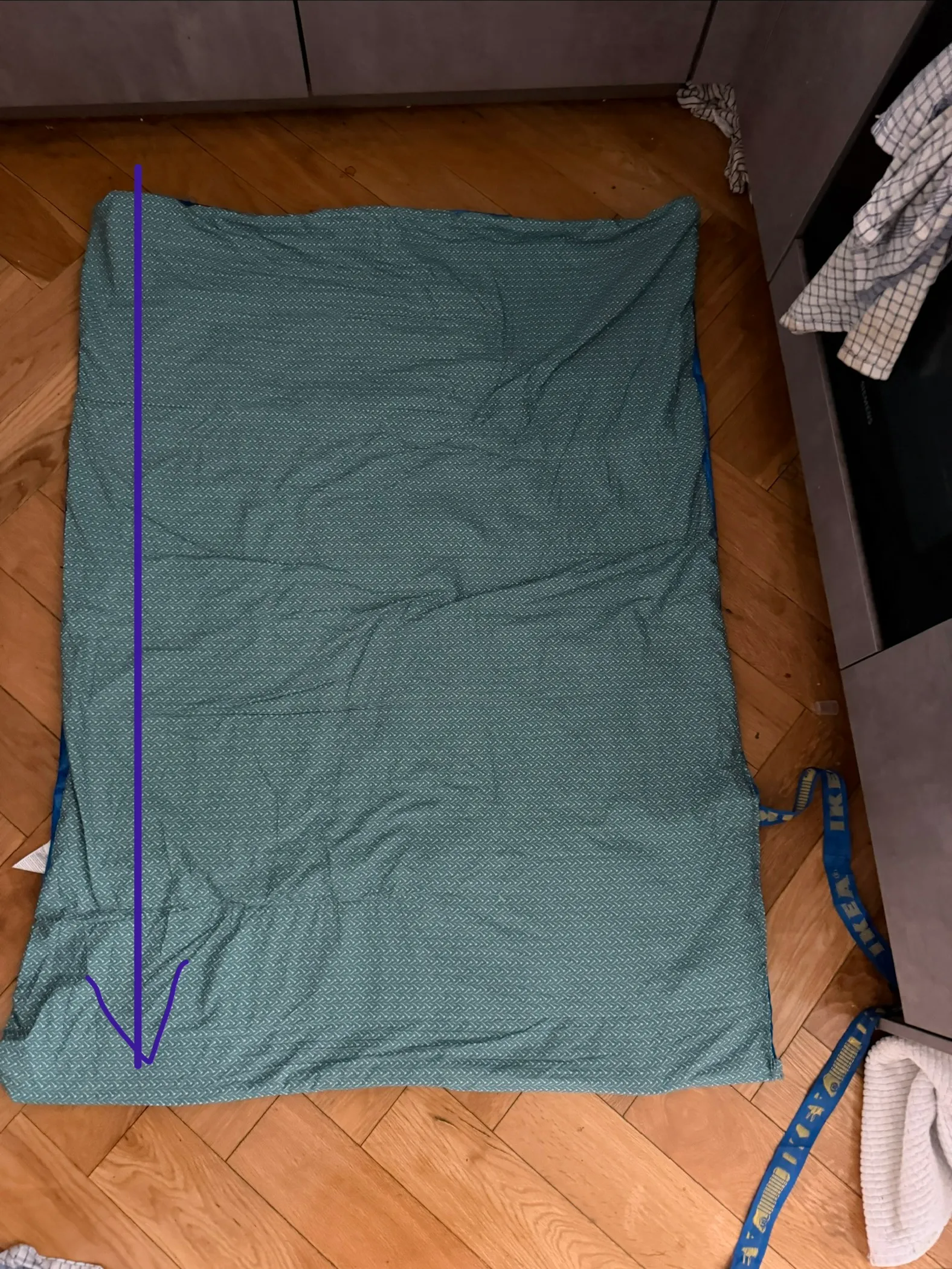 top view of the sewn panel with an arrow pointing down