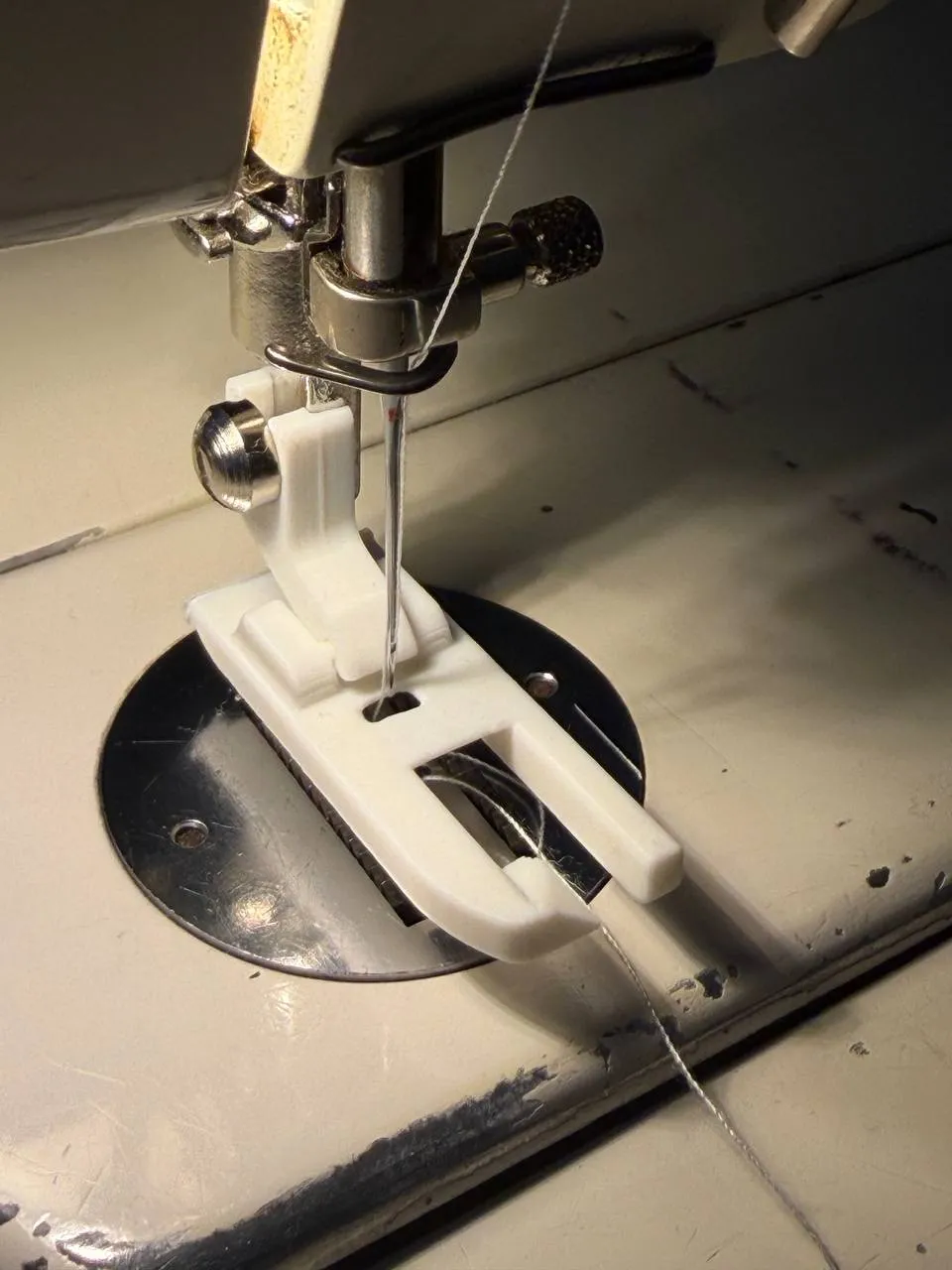 The printed white flat-fell foot snapped onto the vintage machine, threaded and ready to sew
