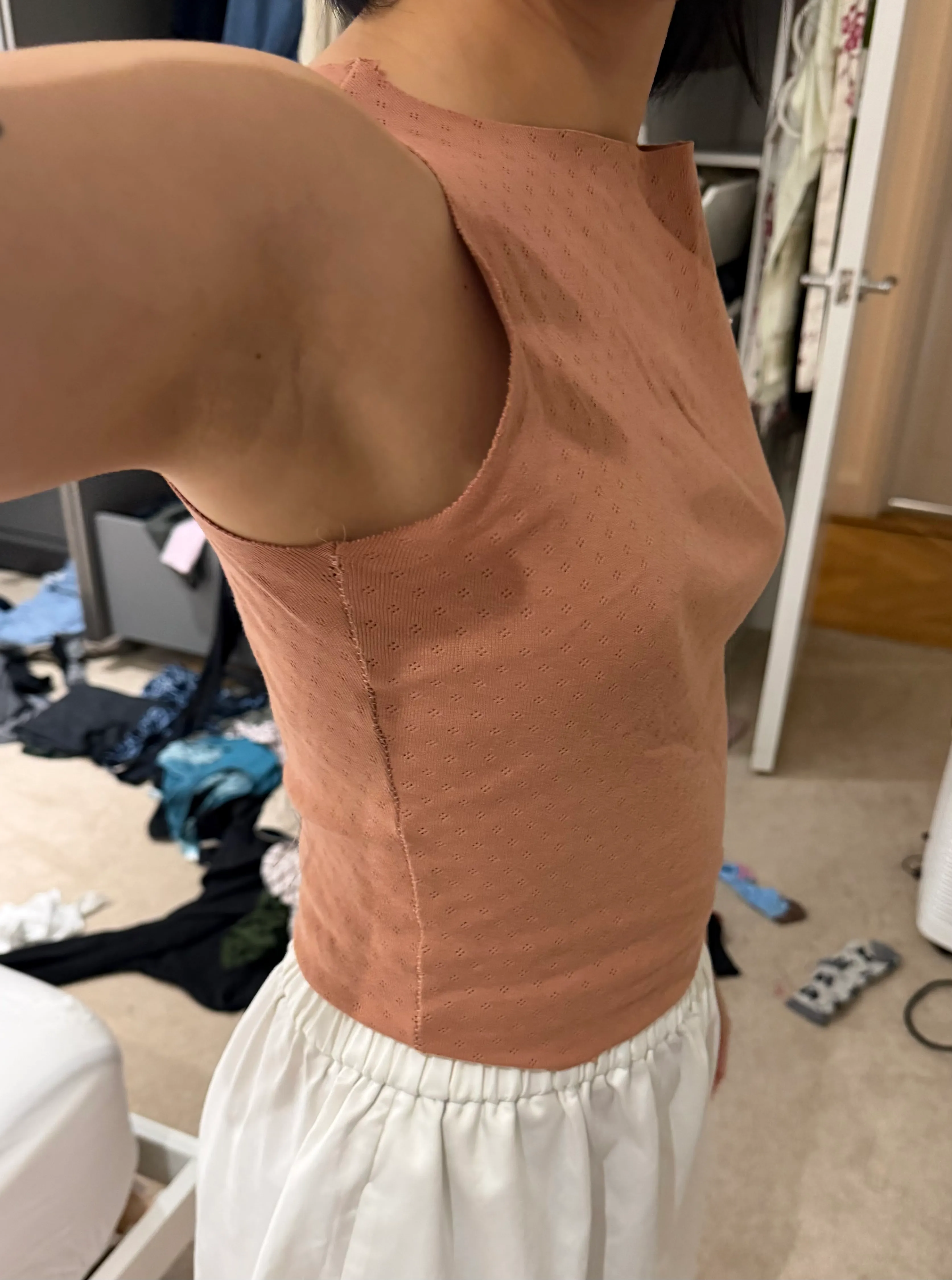 side view of raw edge without armhole extension arm up