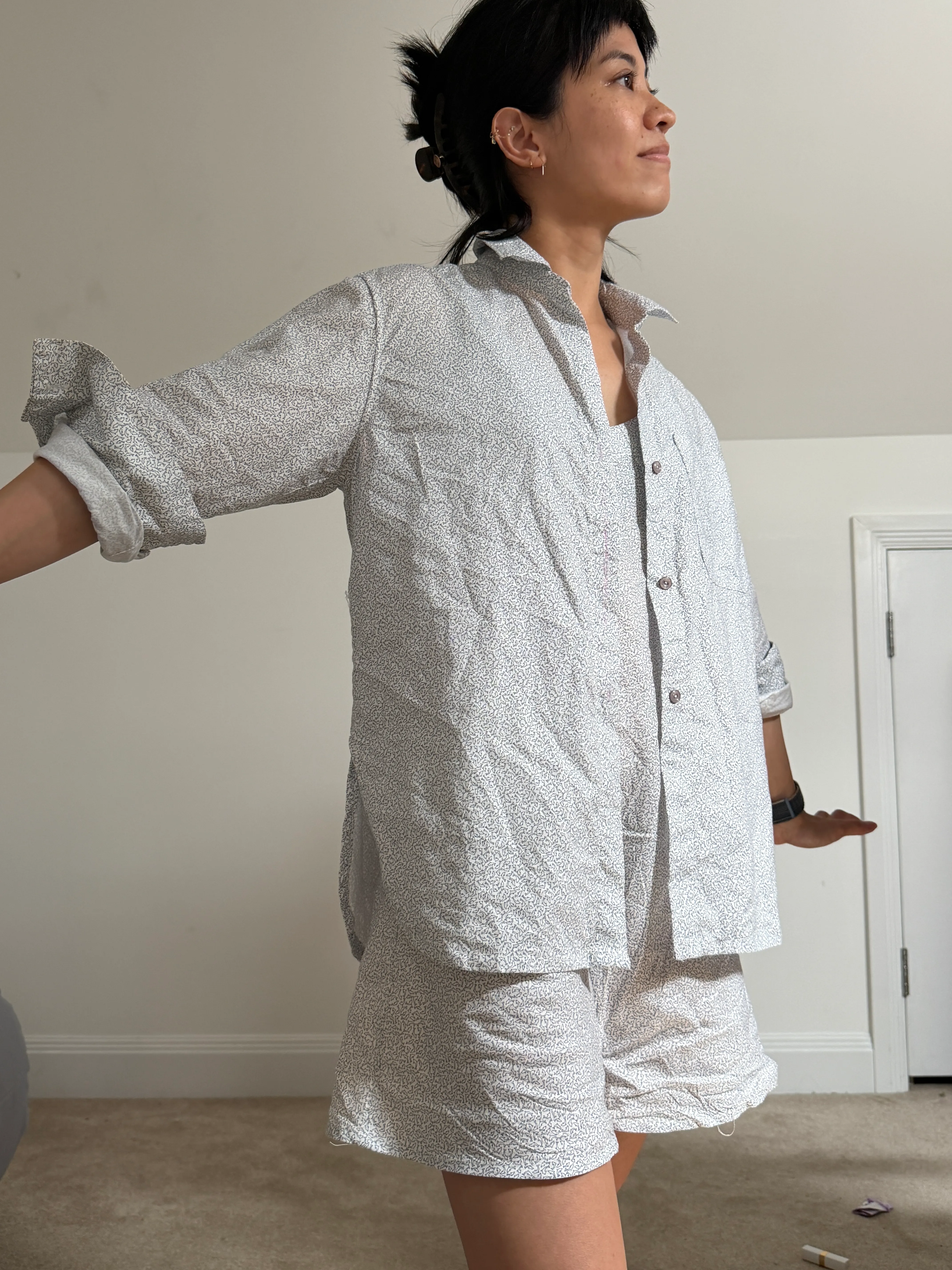 side view of celina wearing the button up shirt